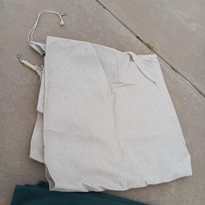 2 TRIANGLE SHADE TARPS AND SOME OUTDOOR MATERIAL
