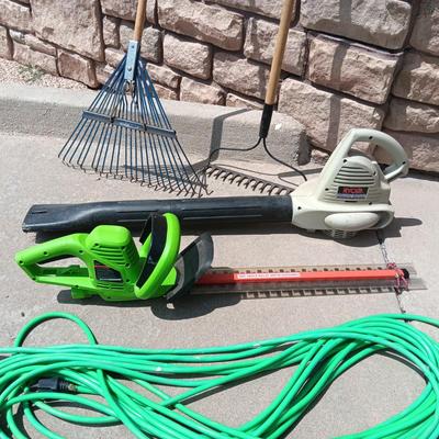 LEAF BLOWER, HEDGE TRIMMER, NICE EXTENSION CORD AND 2 RAKES
