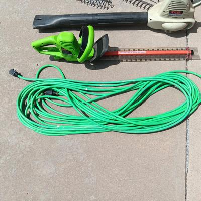 LEAF BLOWER, HEDGE TRIMMER, NICE EXTENSION CORD AND 2 RAKES