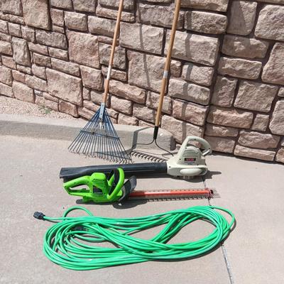 LEAF BLOWER, HEDGE TRIMMER, NICE EXTENSION CORD AND 2 RAKES