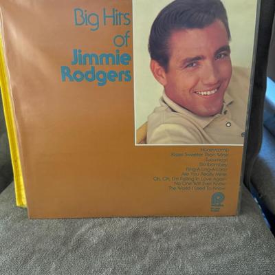 Sale Photo Thumbnail #410: "Big Hits of Jimmie Rodgers". 
Additional details include:
Artist: Jimmie Rodgers, a well-known American singer from the 1950s and 60s.
Format: 12" LP (33 RPM vinyl record).
Record Label: Pickwick (also known as Pickwick/33 Records). The specific release 