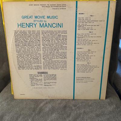 Sale Photo Thumbnail #415: "Henry Mancini Presents The Academy Award Songs", a classic vinyl release by the acclaimed composer and conductor Henry Mancini. 
Here's more about this album:
Artist: Henry Mancini and His Orchestra and Chorus.
Title: "Henry Mancini Presents The Academy 