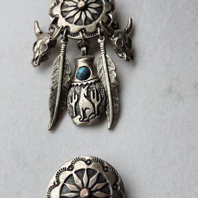 Sale Photo Thumbnail #546: Silver tone, Southwest style 
No markings
Feather style with concho style stamping