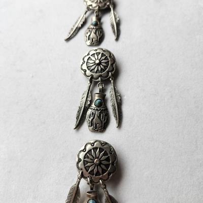 Sale Photo Thumbnail #545: Silver tone, Southwest style 
No markings
Feather style with concho style stamping