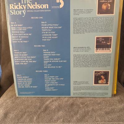 Sale Photo Thumbnail #417: The Ricky Nelson Story," a 3-record vinyl LP compilation set. 
Here's what you can know about it:
Artist: The compilation features the legendary American singer-songwriter and actor Ricky Nelson, known for his influential contributions to rock and roll an