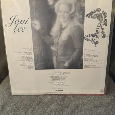Sale Photo Thumbnail #419: "Joni Lee," a self-titled LP released in 1976 by MCA Records. 
Key facts about Joni Lee:
Joni Lee Ryles (born July 2, 1957, as Joni Lee Jenkins) is an American country music singer.
She is the daughter of Conway Twitty, a Country Music Hall Of Fame induct