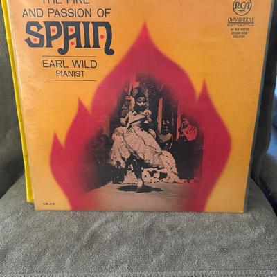 Sale Photo Thumbnail #420: "The Fire and Passion of Spain" by American pianist Earl Wild. 
Here's more information about this album and artist:
Artist: Earl Wild was a renowned American pianist, known for his virtuosity and Romantic style, often referred to as "the last of the grea