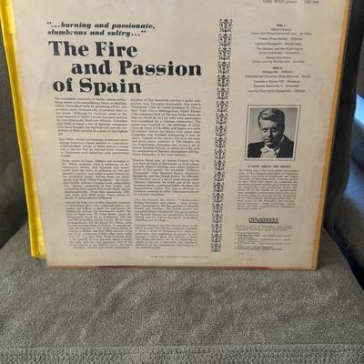 Sale Photo Thumbnail #421: "The Fire and Passion of Spain" by American pianist Earl Wild. 
Here's more information about this album and artist:
Artist: Earl Wild was a renowned American pianist, known for his virtuosity and Romantic style, often referred to as "the last of the grea