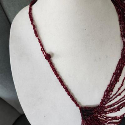 Sale Photo Thumbnail #562: Dark red seed beads with 25 inch drop.  Excellent condition