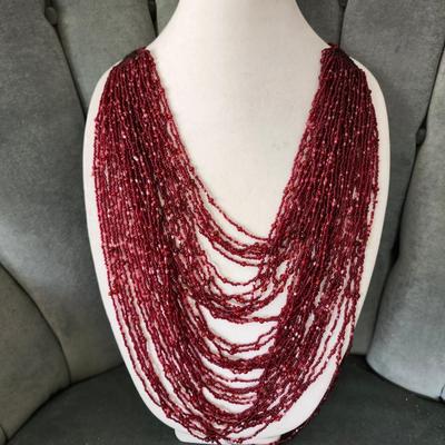 Sale Photo Thumbnail #560: Dark red seed beads with 25 inch drop.  Excellent condition