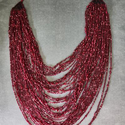 Sale Photo Thumbnail #561: Dark red seed beads with 25 inch drop.  Excellent condition