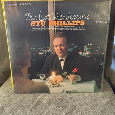 Sale Photo Thumbnail #422: "Our Last Rendezvous" by Stu Phillips. 
Here's some information about the album:
Artist: Stu Phillips.
Album Title: Our Last Rendezvous.
Release Year: 1968.
Genre: Primarily Country, with elements of Folk and World music.
Record Label: RCA Victor Dynagroo