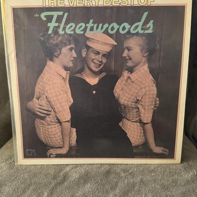 Sale Photo Thumbnail #430: "The Very Best of The Fleetwoods" by the American vocal group, The Fleetwoods. 
Here's information about the album:
Artist: The Fleetwoods, a doo-wop group from Olympia, Washington, included Gary Troxel, Gretchen Christopher, and Barbara Ellis.
Album Titl