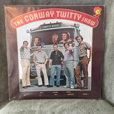 Sale Photo Thumbnail #260: "The Conway Twitty Show" released in 1975. 
Here's more about this album:
Artist: The album features Conway Twitty and other performers, notably his band known as "The Twitty Birds," and potentially members of his family, including his children.
Release D