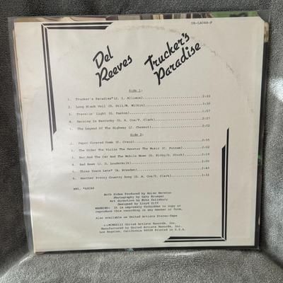 Sale Photo Thumbnail #303: "The Best of Jim Reeves". 
Here's some information about the album:
Artist: Jim Reeves, an American country music singer known for his smooth, "Nashville Sound" style.
Release: The album was released in 1964 on RCA Victor.
Significance: It was a commercia