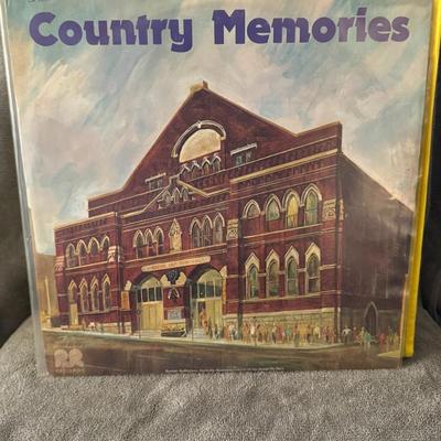 Sale Photo Thumbnail #226: "Country Memories". 
Here's what you might like to know about it:
Album Title: Country Memories.
Release Details: It's a country music compilation album, likely released by Columbia Records or CSP Columbia Records around 1973.
Cover Art: The album cover f