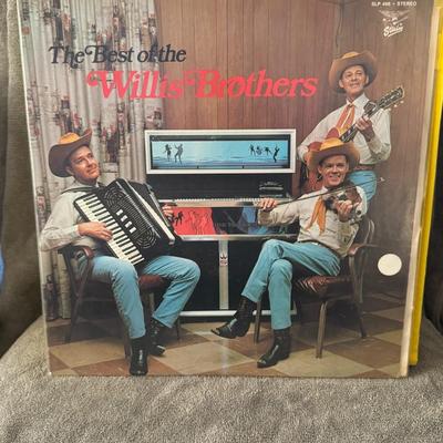 Sale Photo Thumbnail #442: "The Best of The Willis Brothers". This is a compilation album of country music by the American group The Willis Brothers. 
Key details about this album include:
Artist: The Willis Brothers, known for their country and truck-driving music.
Album Title: Th