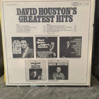 Sale Photo Thumbnail #461: "David Houston's Greatest Hits," a vinyl LP released by Epic Records in 1968. 
This compilation album features some of David Houston's most popular songs, including his signature hit "Almost Persuaded," which reached number one on the Billboard Hot Countr