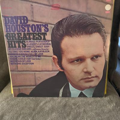 Sale Photo Thumbnail #460: "David Houston's Greatest Hits," a vinyl LP released by Epic Records in 1968. 
This compilation album features some of David Houston's most popular songs, including his signature hit "Almost Persuaded," which reached number one on the Billboard Hot Countr