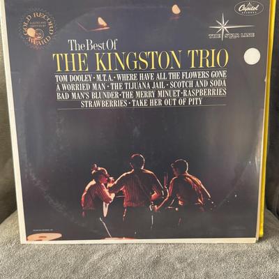 Sale Photo Thumbnail #292: "The Best Of The Kingston Trio", a compilation album by the iconic folk music group, The Kingston Trio. 
Key details about the album:
Artist: The Kingston Trio.
Title: The Best Of The Kingston Trio.
Label: Capitol Records, under "The Star Line" imprint.
F