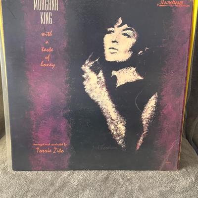 Sale Photo Thumbnail #228: "With a Taste of Honey" by Morgana King, released in 1964 on the Mainstream Records label. 
Here's more information about the album:
Artist: Morgana King, an acclaimed American jazz singer and actress known for her distinct vocal style and her role as Mrs