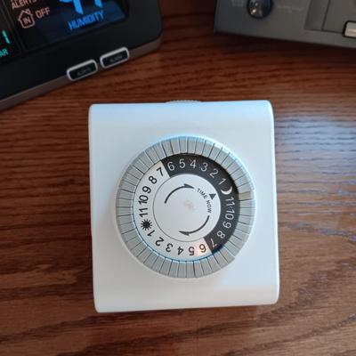 ATOMIC CLOCK AND A RCA ALARM CLOCK RADIO