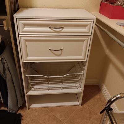 A CLOSET CHEST WITH PULL OUT BASKET