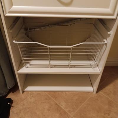 A CLOSET CHEST WITH PULL OUT BASKET