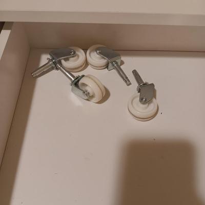 A CLOSET CHEST WITH PULL OUT BASKET