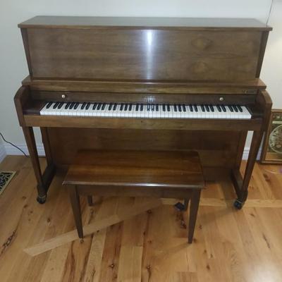 BALDWIN PIANO WITH BENCH AND SHEET MUSIC