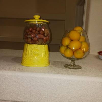 AN UNIQUE COOKIE JAR AND A GLASS BOWL OF FAUX LEMONS