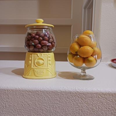 AN UNIQUE COOKIE JAR AND A GLASS BOWL OF FAUX LEMONS