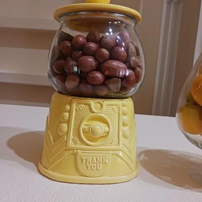 AN UNIQUE COOKIE JAR AND A GLASS BOWL OF FAUX LEMONS