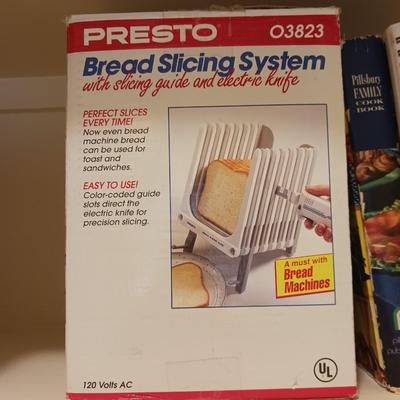 2 QT CROCK POT, BREAD SLICER AND COOKBOOKS
