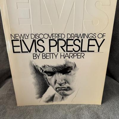 Sale Photo Thumbnail #487: "Newly Discovered Drawings of Elvis Presley by Betty Harper". 
Here's some information about the book:
Author: Betty Harper.
Subject: It features a collection of drawings of Elvis Presley created by artist Betty Harper.
Publication: The book was published