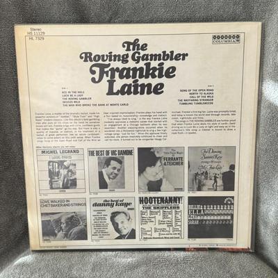 Sale Photo Thumbnail #471: "The Roving Gambler" by Frankie Laine. 
Here's more information about the album:
Artist: Frankie Laine, a renowned American singer known for his powerful voice and diverse musical styles, including pop, jazz, and country.
Album Title: The Roving Gambler.

