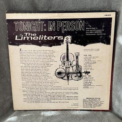 Sale Photo Thumbnail #473: "Tonight: In Person" by The Limeliters, a prominent American folk music group from the 1960s. 
Here's some information about the album and the group:
Album Details: "Tonight: In Person" is a live album recorded by The Limeliters, consisting of Lou Gottlie