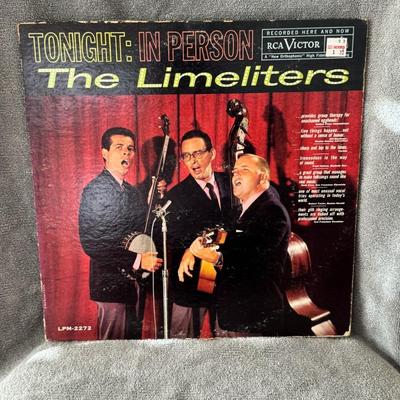 Sale Photo Thumbnail #472: "Tonight: In Person" by The Limeliters, a prominent American folk music group from the 1960s. 
Here's some information about the album and the group:
Album Details: "Tonight: In Person" is a live album recorded by The Limeliters, consisting of Lou Gottlie