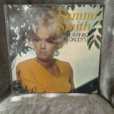Sale Photo Thumbnail #330: "The Rainbow in Daddy's Eyes" by Sammi Smith. 
Here's some information about the album:
Artist: Sammi Smith, a prominent figure in the 1970s "outlaw country" scene and known for her soulful country vocals.
Release Date: The album was initially released in