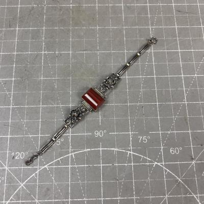 Sale Photo Thumbnail #308: 6" Long. Very Interesting. Wearable. Has a Rust Color Cut Stone. Like Carnelian 