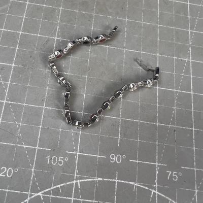 Sale Photo Thumbnail #313: Interesting. Nice. Has Colored stone on one size and faux diamond on the other. 