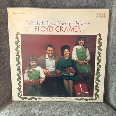 Sale Photo Thumbnail #314: "We Wish You a Merry Christmas" by Floyd Cramer, featuring "The Floyd Cramer Family" on the cover. 
Here is some information about the album:
Artist: Floyd Cramer was an American pianist known for his "slip-note" style and his contributions to the Nashvil