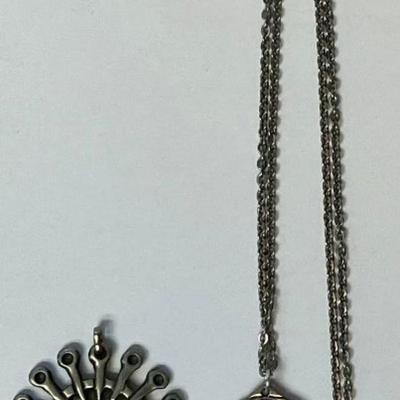 Sale Photo Thumbnail #183: Pendant with chain is by Havstad Tinn-measures 1 1/2 inches in diameter, chain is 25 inches.
The other pendant is by Elvind Hillstad- measures 2 inches in diameter.