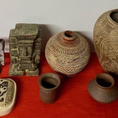 Sale Photo Thumbnail #204: Three pieces are signed Sabah (Malaysia)
Two small vases
Two rustic vases
One hanging vase
One ceramic figure
One candle holder