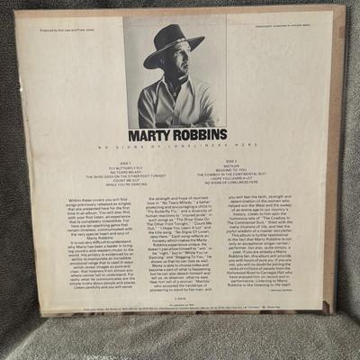 Sale Photo Thumbnail #271: "No Signs of Loneliness Here" by Marty Robbins.
Additional information about the album includes:
Artist: Marty Robbins.
Album Title: No Signs Of Loneliness Here.
Release Date: November 1975.
Label: Columbia Records.
Tracklist Highlights: The album feature
