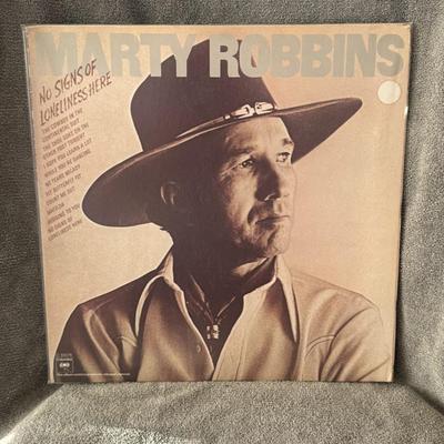 Sale Photo Thumbnail #270: "No Signs of Loneliness Here" by Marty Robbins.
Additional information about the album includes:
Artist: Marty Robbins.
Album Title: No Signs Of Loneliness Here.
Release Date: November 1975.
Label: Columbia Records.
Tracklist Highlights: The album feature