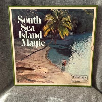 Sale Photo Thumbnail #352: "South Sea Island Magic" 4-LP vinyl record box set, released in 1968 by Reader's Digest. 
Here's some information about this vintage album:
Content: It is a compilation featuring various artists performing Hawaiian and South Sea-themed music, offering a n