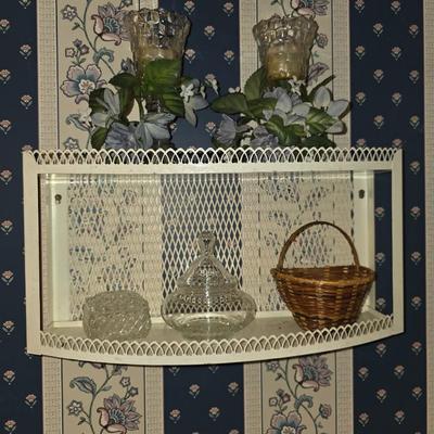 Bathroom wall shelf with trinkets