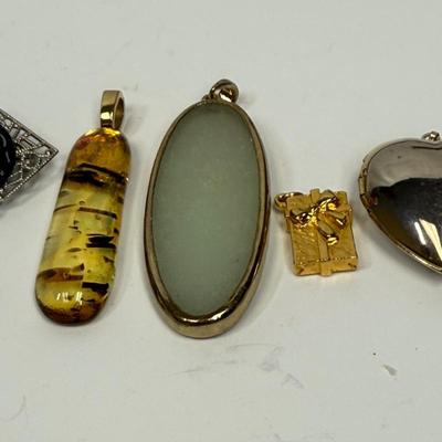 Pendant Lot #1 - misc Pendants in amber, jade, gold tone, etc