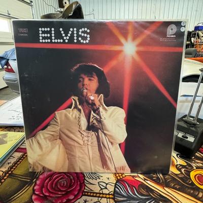 Sale Photo Thumbnail #141: You'll Never Walk Alone album by Elvis Presley. Released in 1971 by RCA Records, this compilation album features gospel recordings from 1957 onward, along with two previously unreleased tracks. The album includes the title track, "You'll Never Walk Alone,